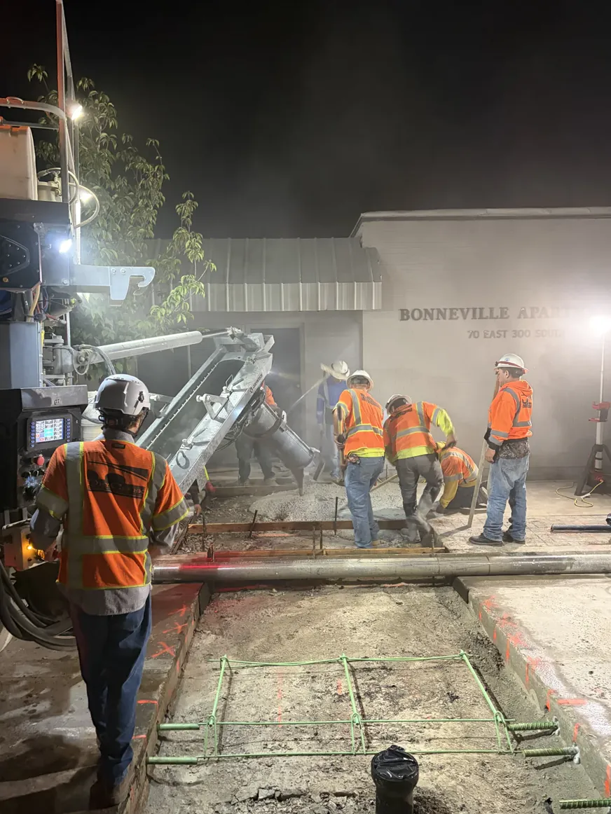J&J crew working at a boring rig during night utility work