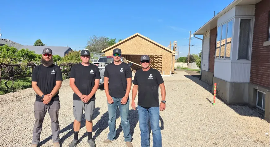 Four J&J crew members on a residential jobsite
